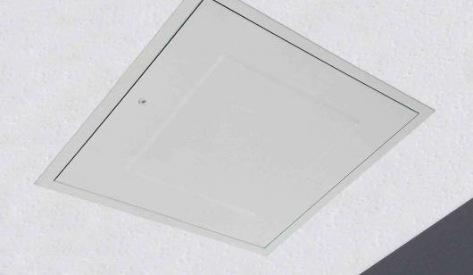 Square, white fire rated loft door installed in ceiling
