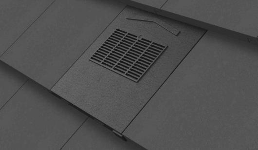 Grey flat edge tile ventilator installed onto grey tile roof