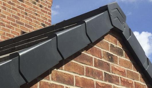 Right and left handed dry fix black verge units fitted to the verge of a roof